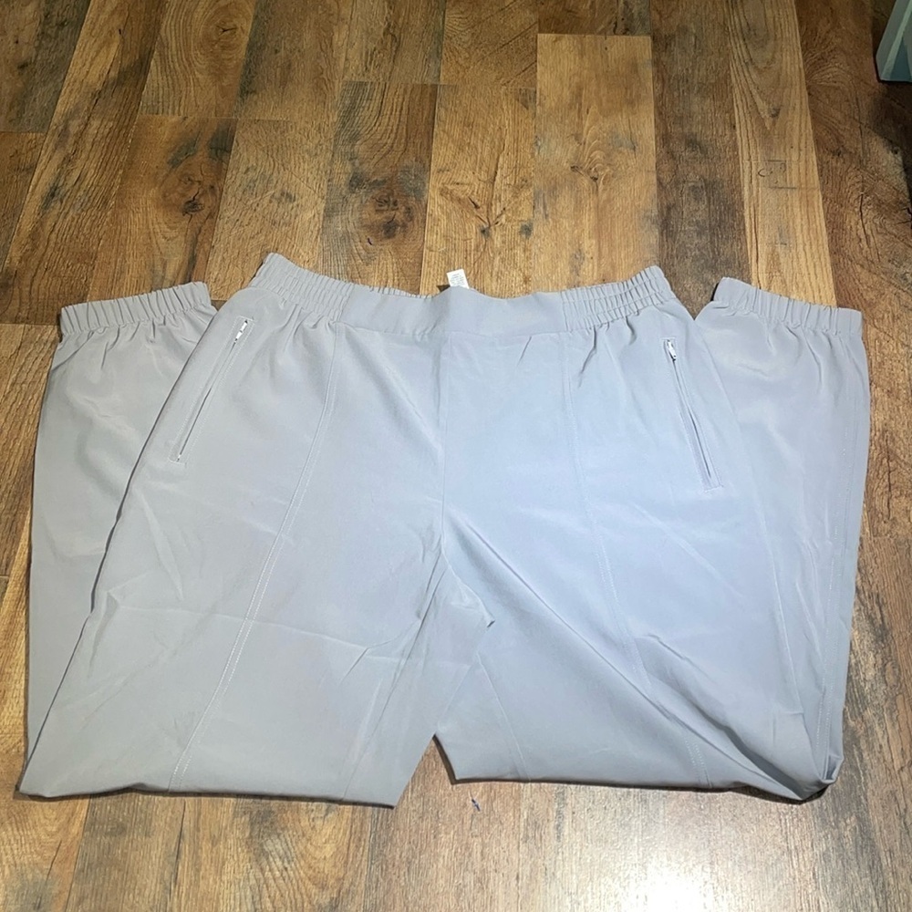 RBX Running Pants.  2 side zipper‎ pockets.  Partial elastic waste. Elastic leg
